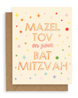 Rainbow colored stars surround the words "Mazel tov on your bat mitzvah" in multi-colored font printed on a cream background. Shown with kraft envelope.