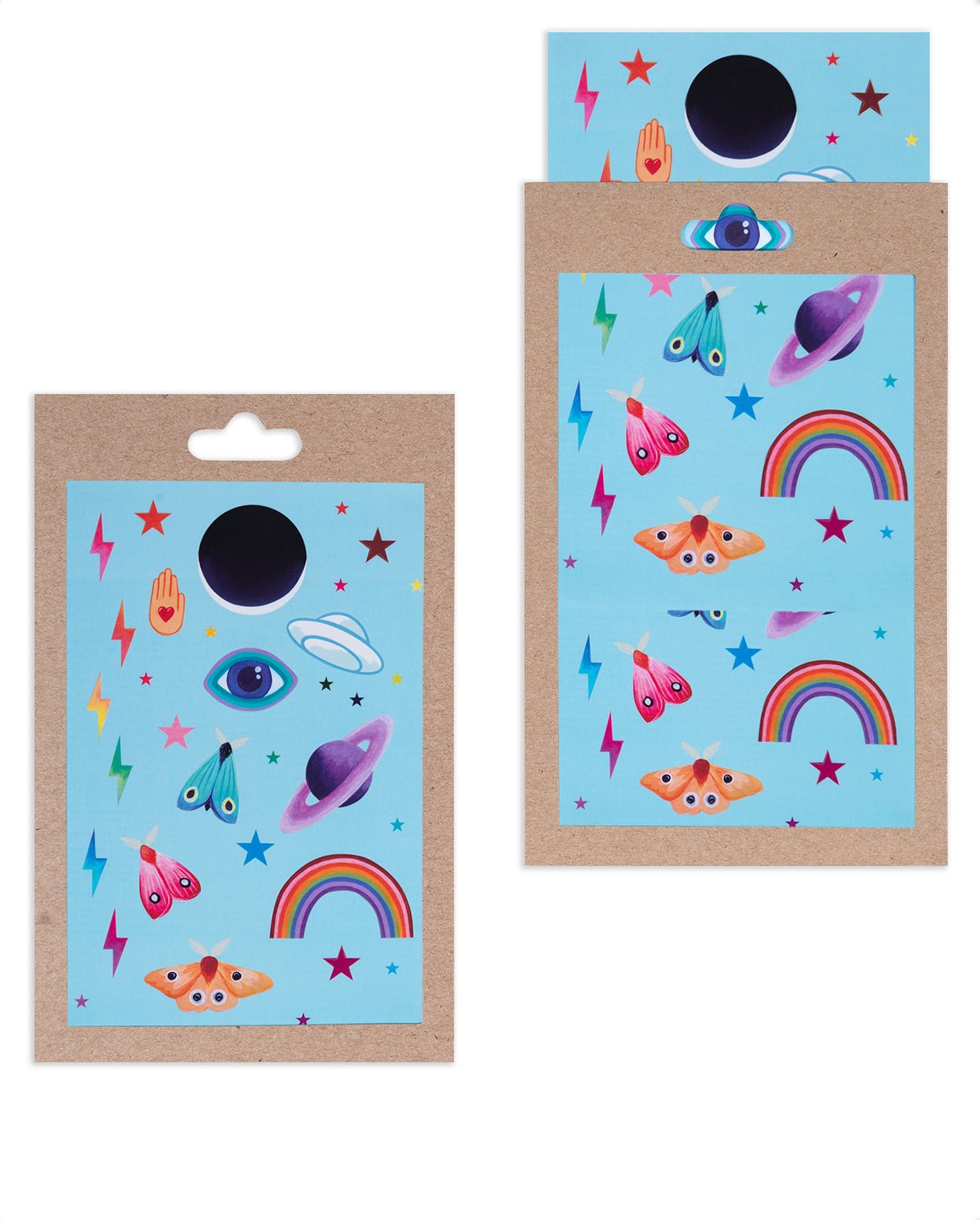 Neon Icons stickers; pink, blue, and orange moths, rainbows, rainbow colored lightning bolts and stars, evil eye, Saturn, Ufo, and a Hamsa hand on a blue sheet against kraft packaging.
