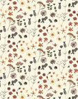 Adelfi gift wrap featuring a dried flower pattern scattered on a cream background.