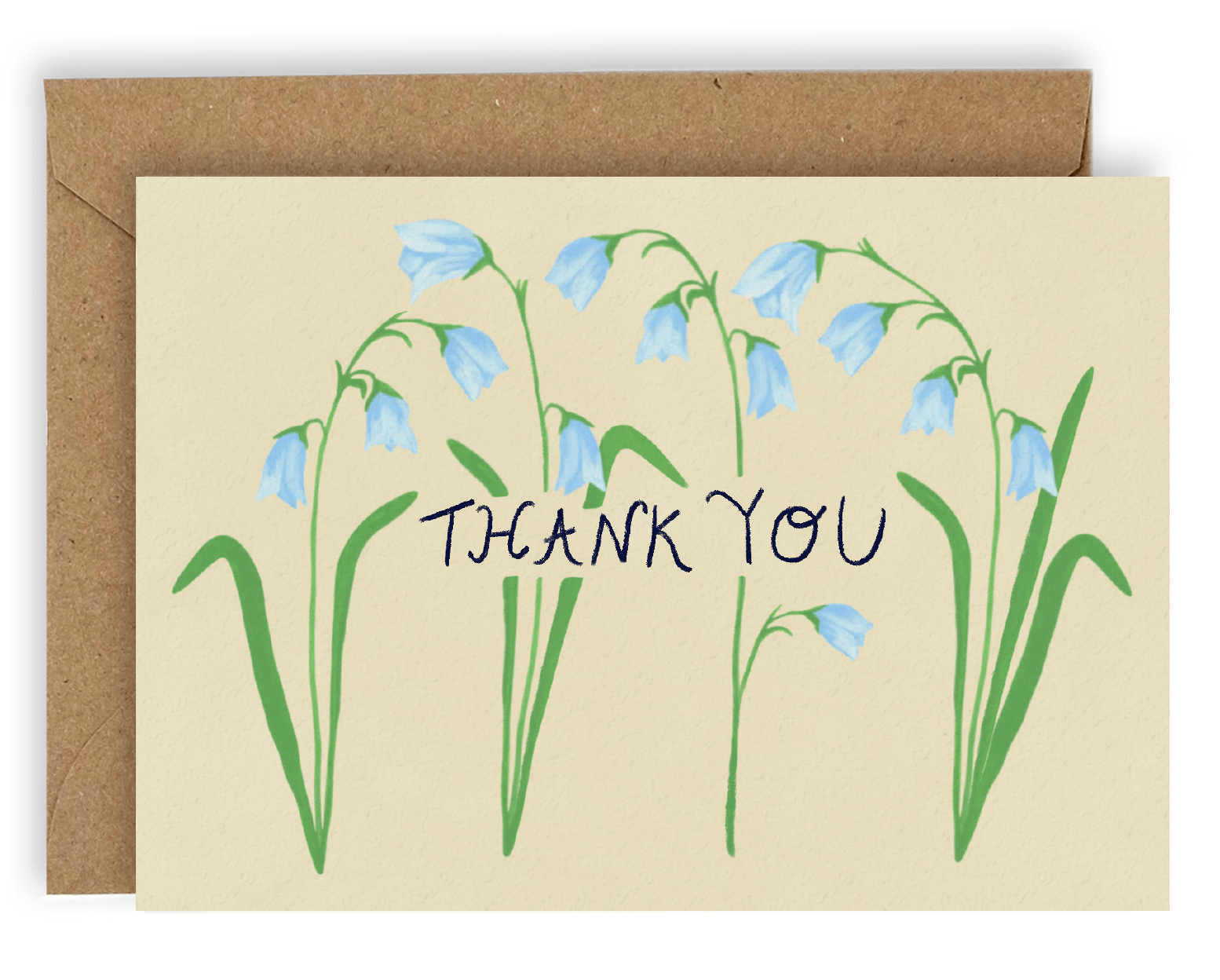 Four drooping blue forest flowers cover the card nearly top to bottom horizontally, with the words &quot;Thank You&quot; going through the center of them in black ink. This design is printed on a cream colored background. Shown with Kraft envelope.