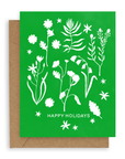 Our new forest flowers design of white outlines of forest flowers on a primary green background with the words "Happy Holidays" in caps lock text at the bottom. Shown with Kraft envelope.
