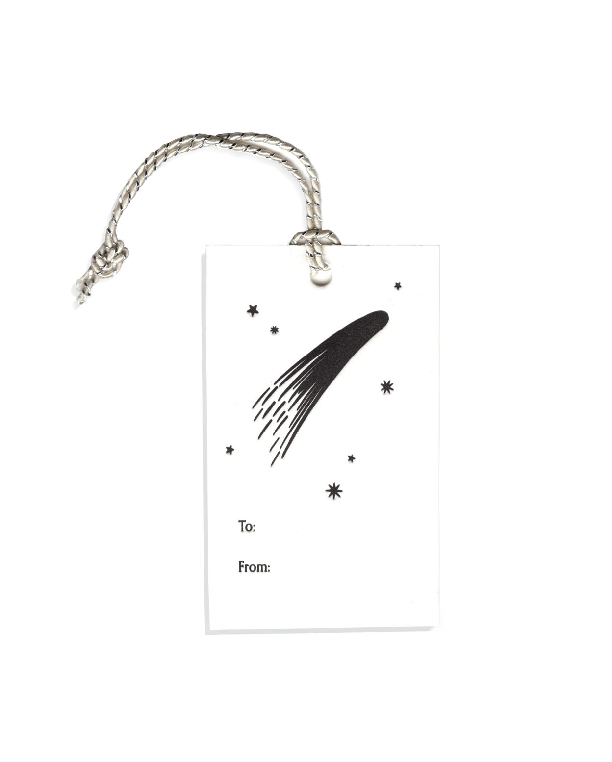 A single letterpressed gift tag with black comets, stars, and the words "to" and "from" in black ink on cream card stock with a silver tie on top.