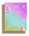 Greeting card with "happy birthday" across the front in white hollow font with neon icons printed on a gradient pink and blue background. Shown with kraft envelope.