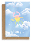 Scorpio  Horoscope card with a kraft envelope. The horoscope symbol is painted in rainbow pastel on a blue background with white clouds. 