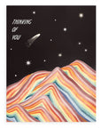 A black sky background with various styles of stars above a rainbow mountain with "Thinking of You" in bold white text aligned at the upper left hand corner of the card printed on cardstock against a white background.
