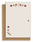 Adelfi monogram "I" notecard with kraft envelopes on a white background.