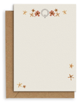 Adelfi monogram "Q" notecard with kraft envelopes on a white background.