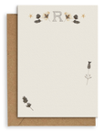 Adelfi monogram "R" notecard with kraft envelopes on a white background.