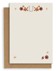 Adelfi monogram "U" notecard with kraft envelopes on a white background.