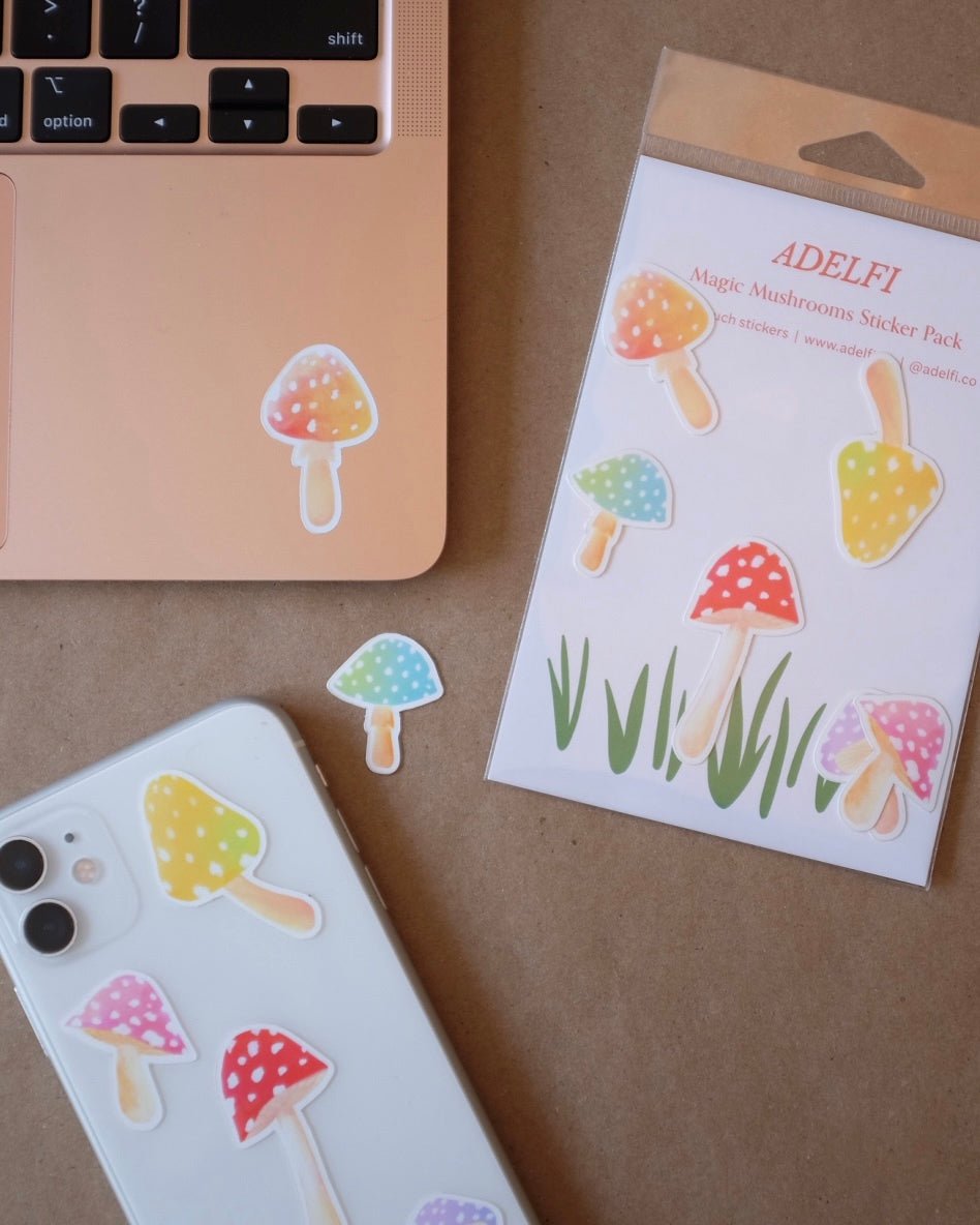 Magic mushroom sticker pack by iPhone and Macbook on kraft paper.