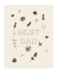 Cream colored card with scattered pressed flowers and the words "Best Dad" in pointillism style font. Shown on white background.