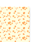 Single sheet of cream colored gift wrap with printed orange California Poppies on top.