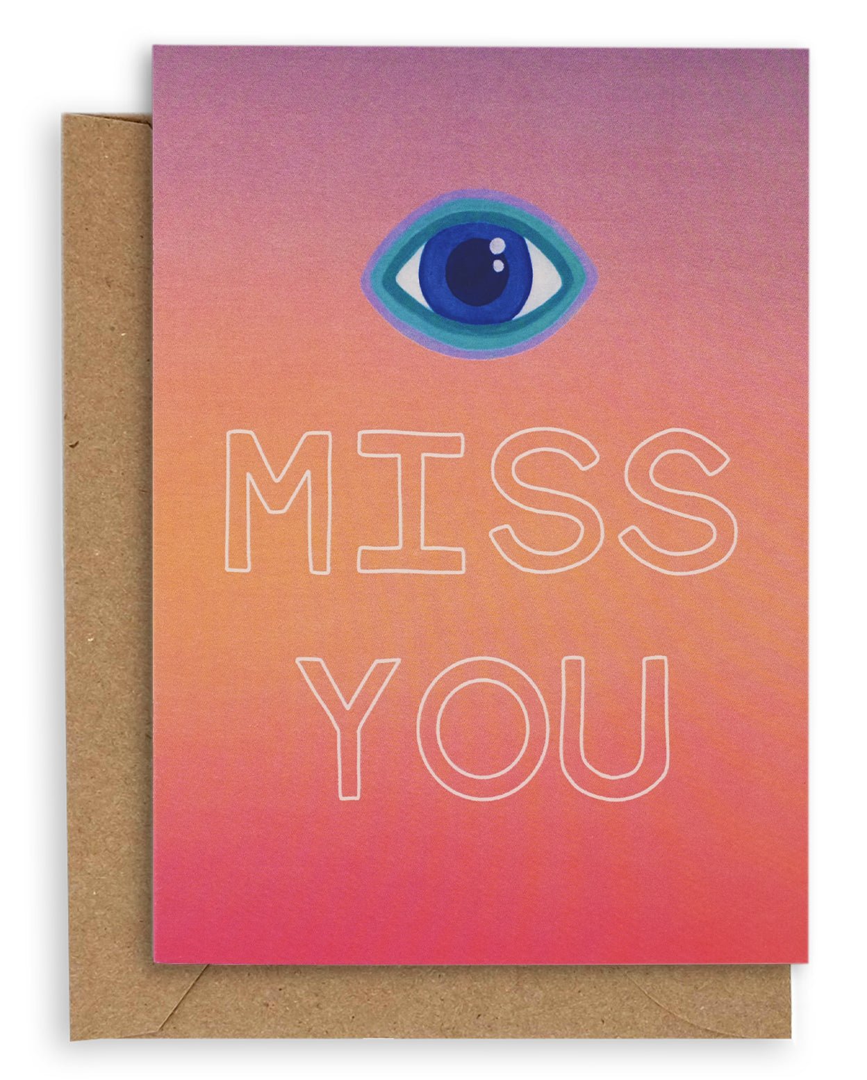 Greeting card with the symbol of an eye followed by the words "Miss You" in white hollow font on a gradient purple, orange and red background. Shown with brown kraft paper envelope.