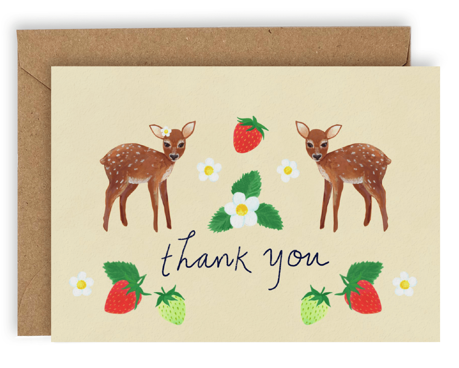 This card features two brown fawn facing each other with heads turned toward the viewer. Three white flowers fill the space between them, with the largest one in the center accompanied by three leaves jutting out on every end and two smaller ones on either side. A lone red strawberry looms above them. Below are the words &quot;Thank You&quot; written in cursive black ink with green, followed by red, strawberries and white flowers on either side. Printed on a cream colored background. Shown with Kraft envelope.