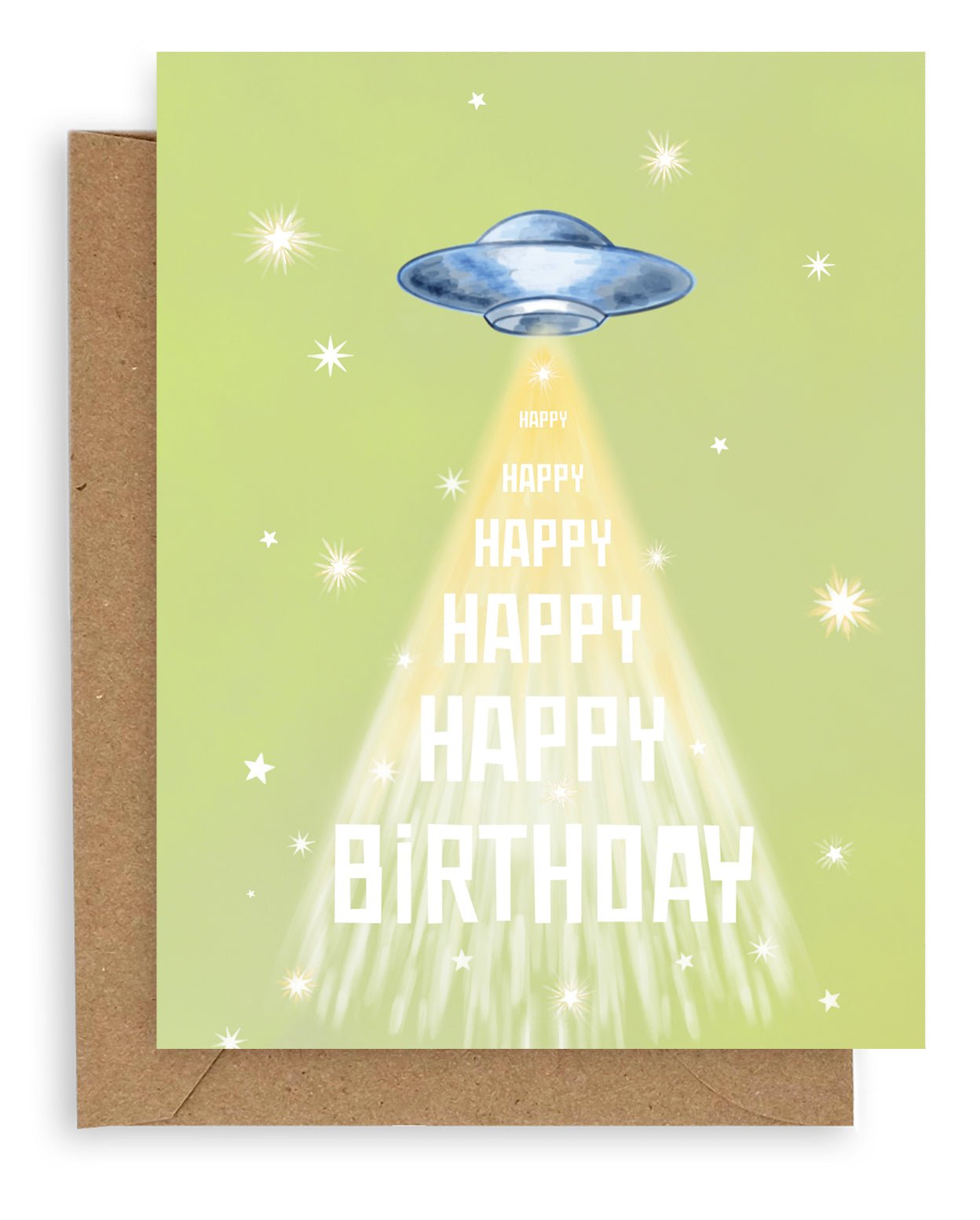 Greeting card with green background featuring stars and flying saucer with "happy birthday" printed down the front. Shown with kraft envelope.