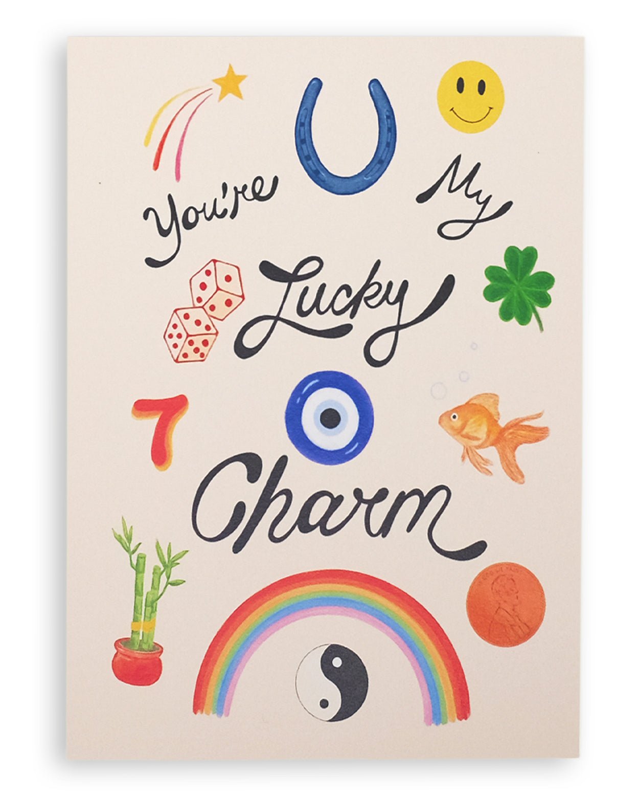Cream colored card with various lucky items on the front: penny, goldfish, four leaf clover, dice, the number seven, bamboo plant, yin and yang, rainbow, horseshoe, shooting star, and smiley face with the words &quot;You&#39;re My Lucky Charm&quot; printed on cardstock. Shown on white background.