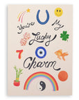 Cream colored card with various lucky items on the front: penny, goldfish, four leaf clover, dice, the number seven, bamboo plant, yin and yang, rainbow, horseshoe, shooting star, and smiley face with the words "You're My Lucky Charm" printed on cardstock. Shown on white background.