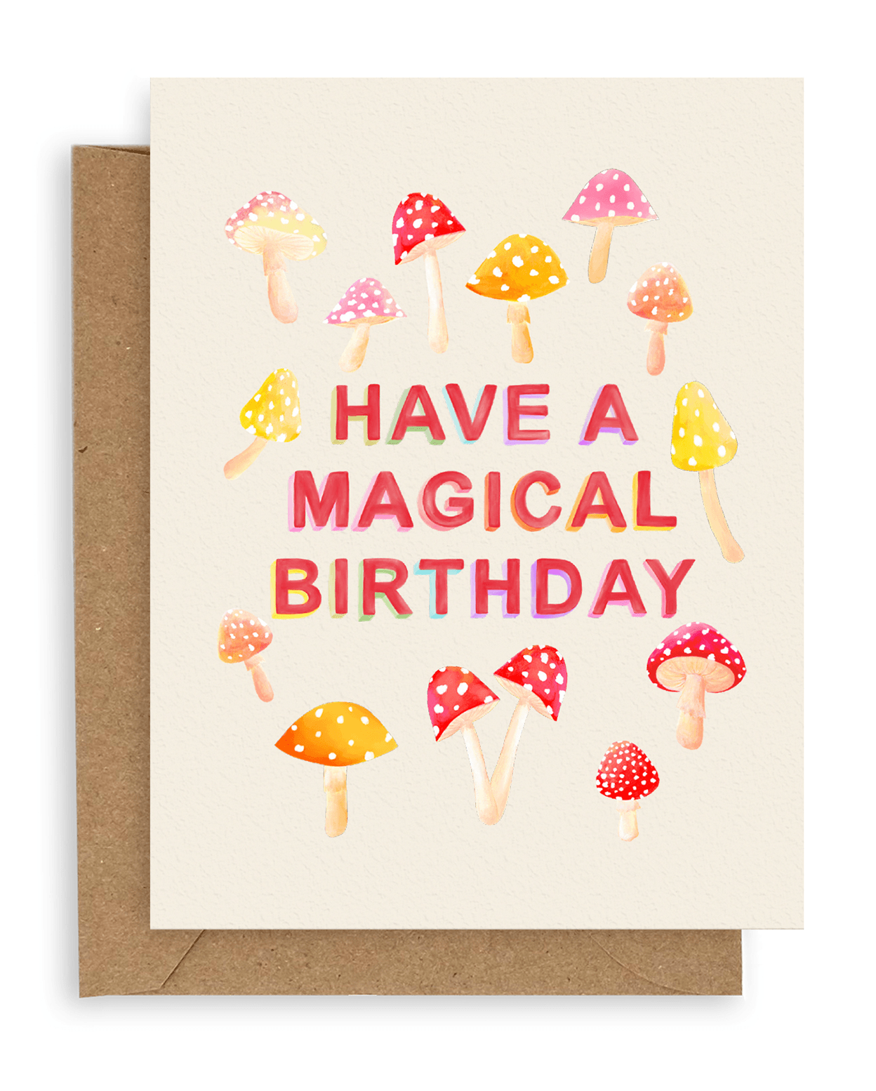 Cream colored card with pink, orange and red mushrooms mushrooms and red printed text with the words &quot;Have A Magical Birthday&quot; in the middle. Shown with kraft envelope.