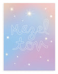 "Mazel Tov" in large, hollow cursive on a gradient blue-lavender background with various kinds of stars printed on cardstock with a white background.