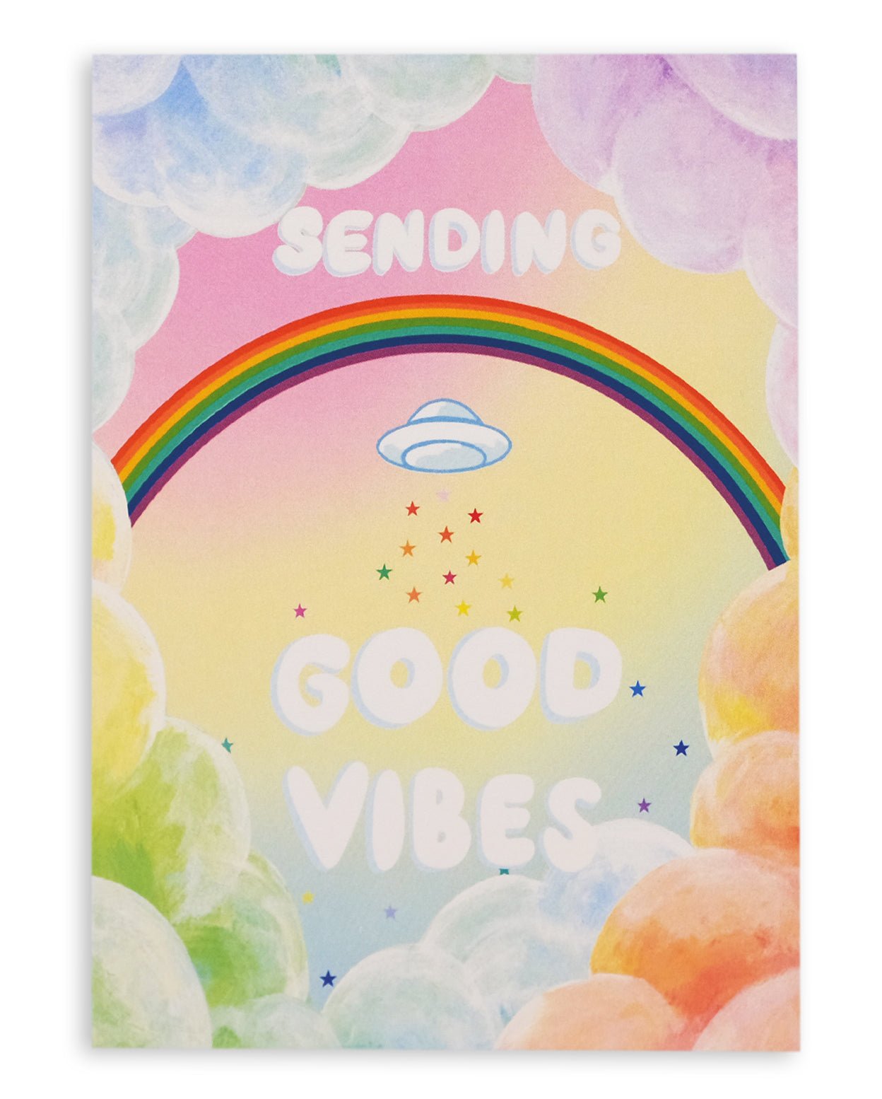 Colorful greeting card with cumulus clouds surrounding a rainbow with a UFO below it, followed by rainbow stars and clouds, and the words &quot;Sending Good Vibes&quot; on the front. Shown against a white background.