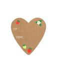 This Gift Sticker is heart-shaped with a red strawberry in the upper left hand corner, a green and red strawberry at the bottom, and a white flower with three leaves in the upper right corner, with the words "To" and "From" written in cursive in the center left. 