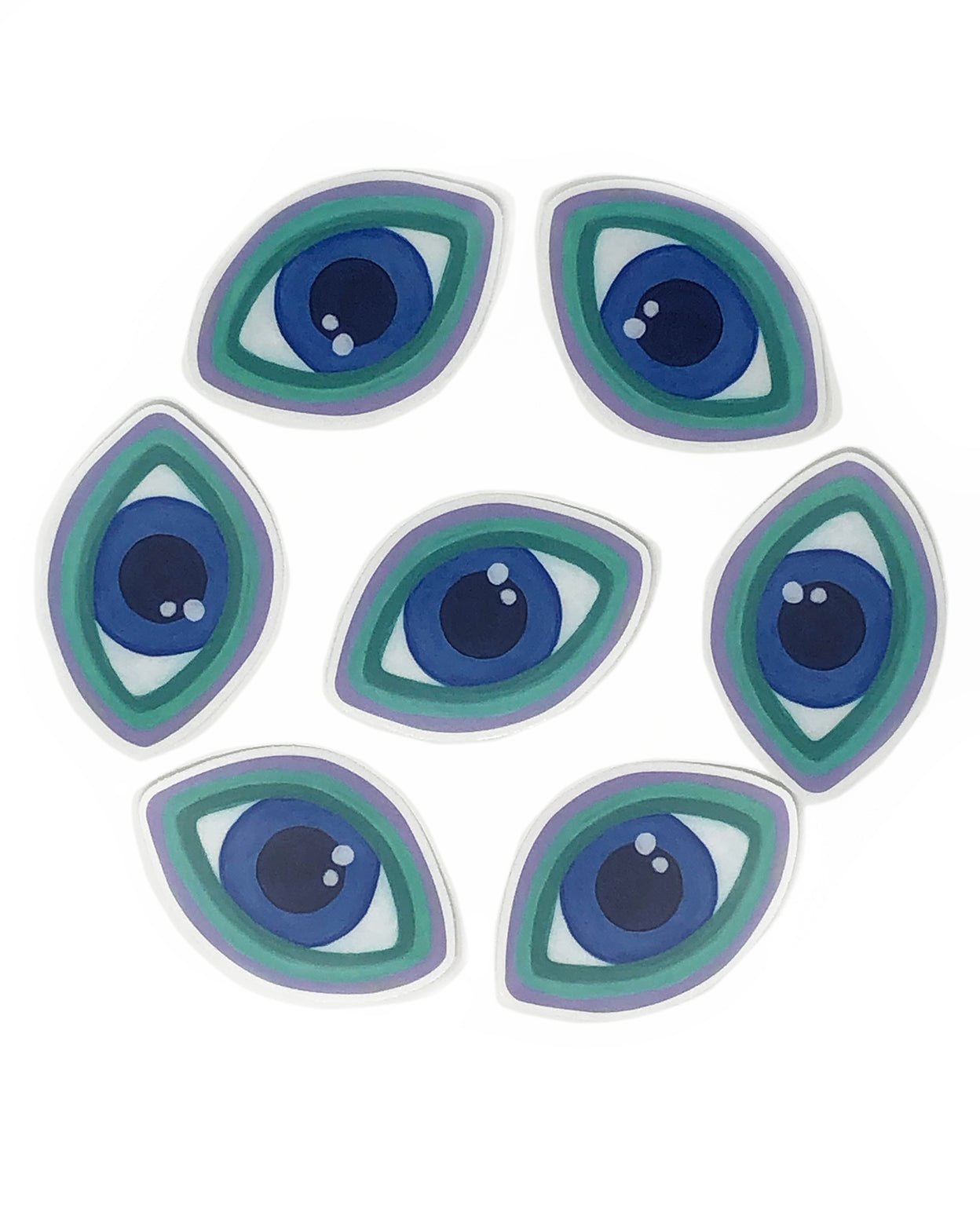A circle of green, purple and blue Evil Eye soft touch stickers surrounding a single Evil Eye sticker with a white background. 
