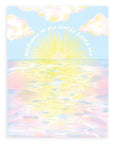 "Welcome To The World Little One" printed in white cursive font bending around a sunset over the ocean with a pink and blue cloudy landscape design printed on cardstock against a white background.