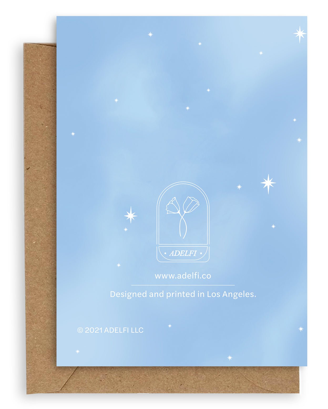Back of the Adelfi horoscope card, pale blue with white twinkle stars on a kraft envelope. 