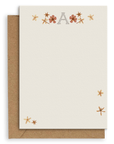 Adelfi monogram "A" notecard with kraft envelopes on a white background.
