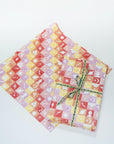 Summer Checkboard gift wrap. Shown in use with green ribbon.